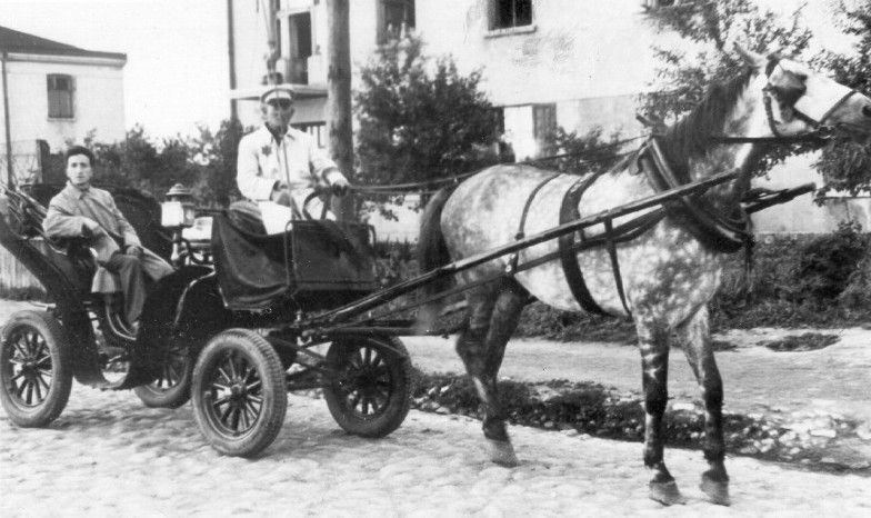 The photographer Mendel Grosman traveling in Rumkowski's carriage in the Lodz ghetto.
